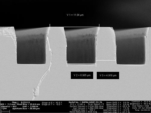 Sample S4: Profile view. The recipe InP etch has been used. The sample has been run on a SiO2 carrier wafer. There is not much CD change compared to the oxide mask before the etch. It seems like the SiO2 mask is gone and the sidewall angle from the mask has been transferred into the sample. The sidewall profile is quit vertical in the lower part.