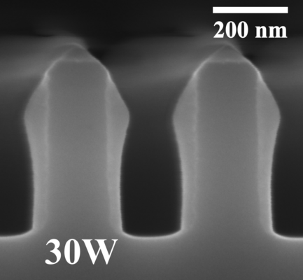 Deposition with 30 W RF bias. Visible erosion of the Si trench.