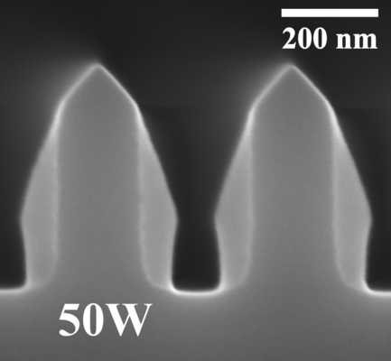 Deposition with 50 W RF bias. Milling turns the trench top into triangular shape.